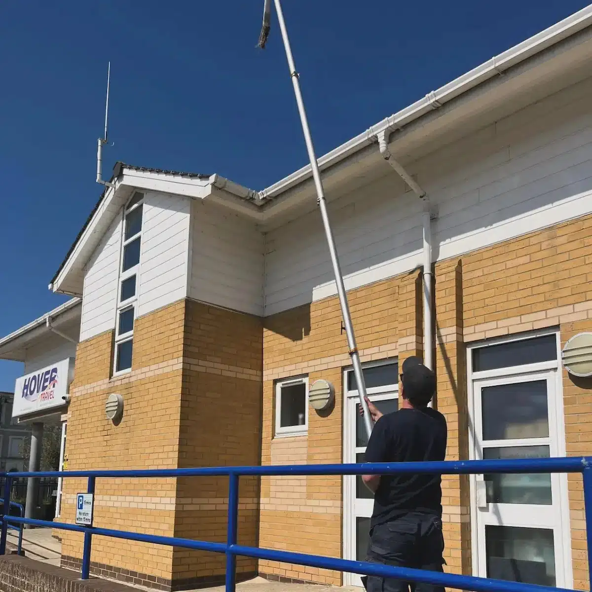 Gutter vacuum in use along the Hovertravel building in Ryde