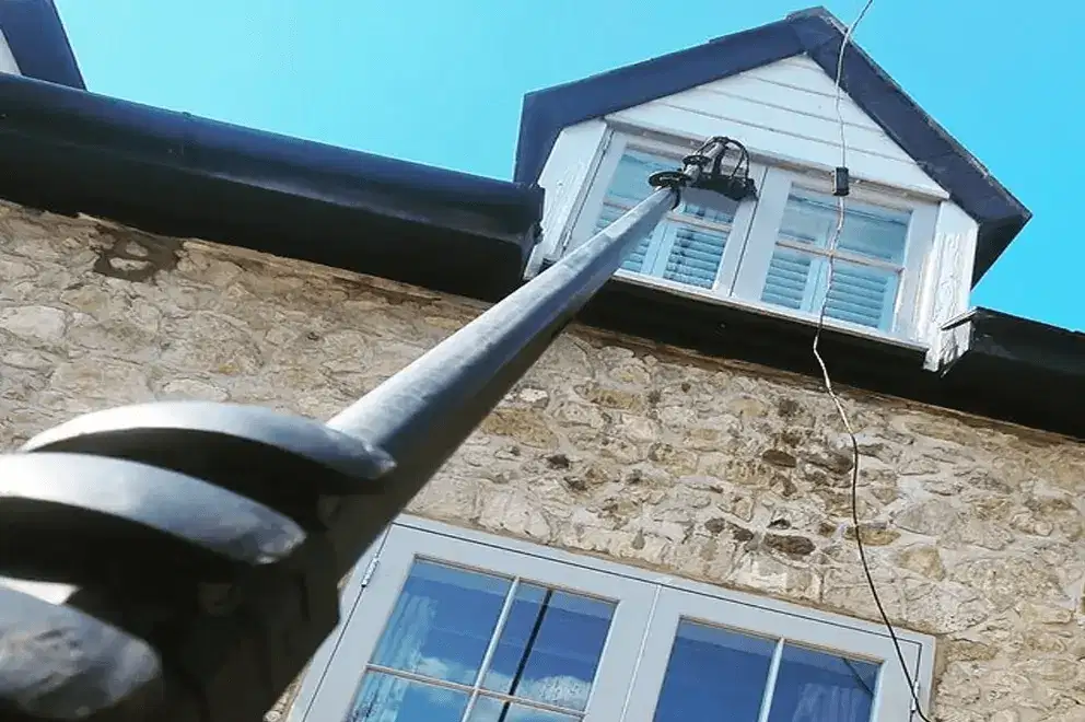 Windows cleaned with the pure-water pole on a first-floor bay